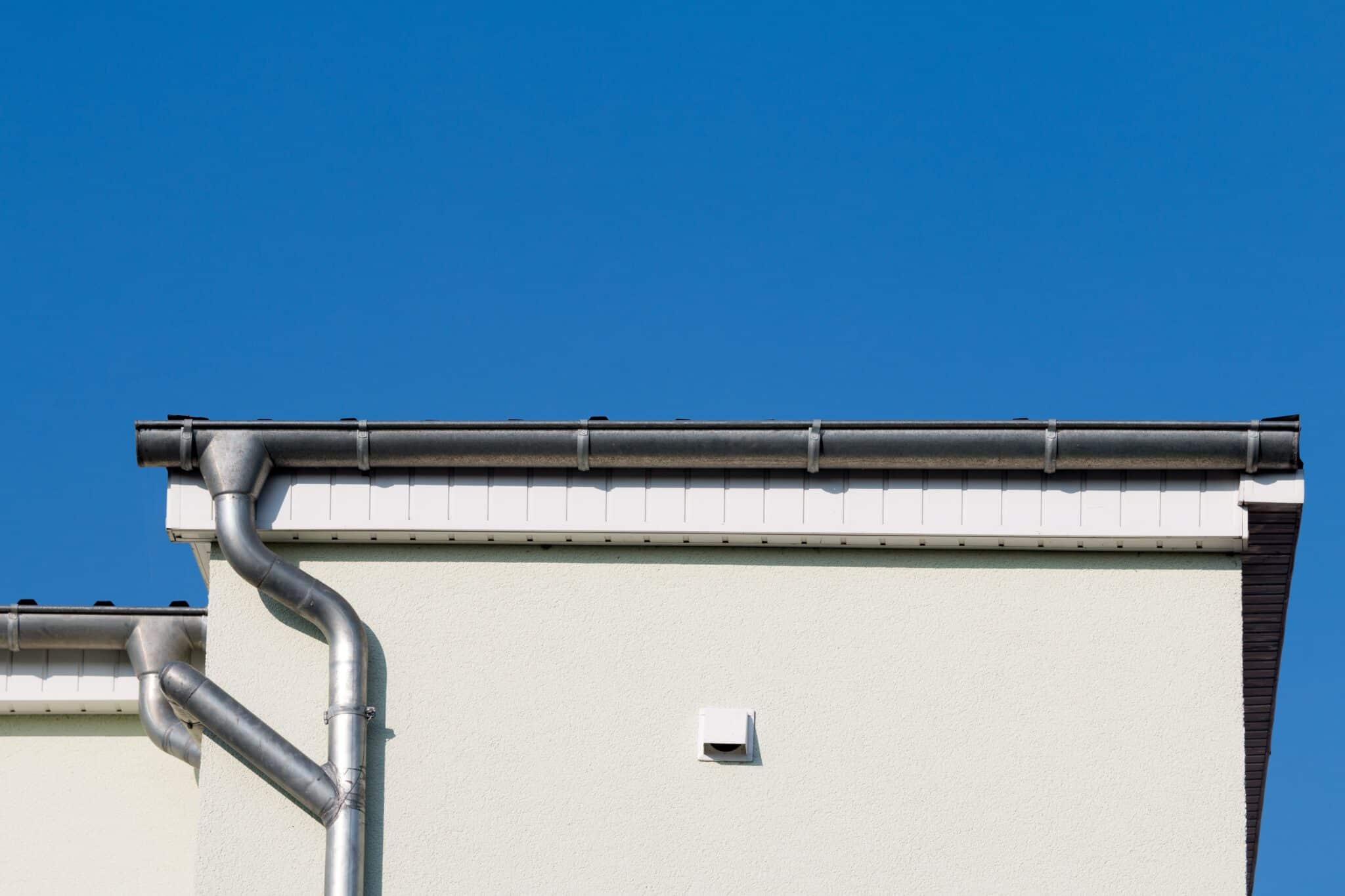 Gutter at a house in front of blue sky